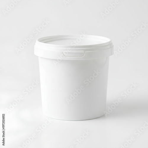 White plastic bucket with lid isolated on a plain background studio shot.