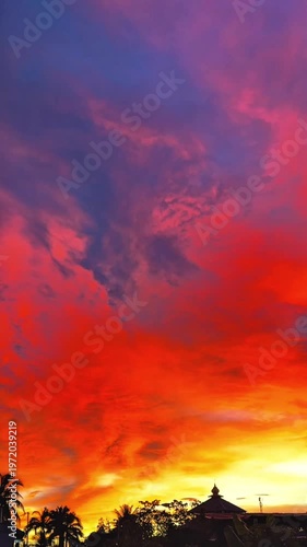 4K Dramatic Orange and Purple Sunset Sky with Building Silhouette