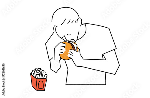 ハンバーガーにかぶりつく男性