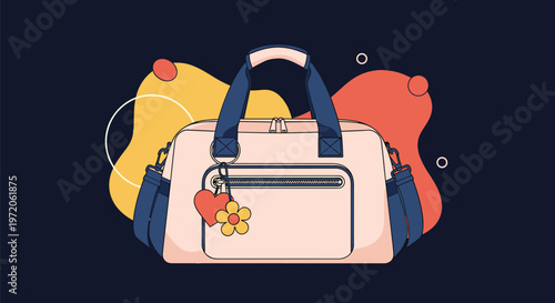 Stylish pink gym or travel duffel bag with blue handles and a decorative heart and flower charm keychain piece.