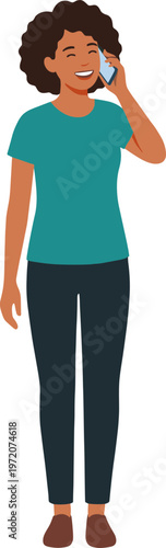 A woman wearing a green shirt talks on the phone outdoors smiling