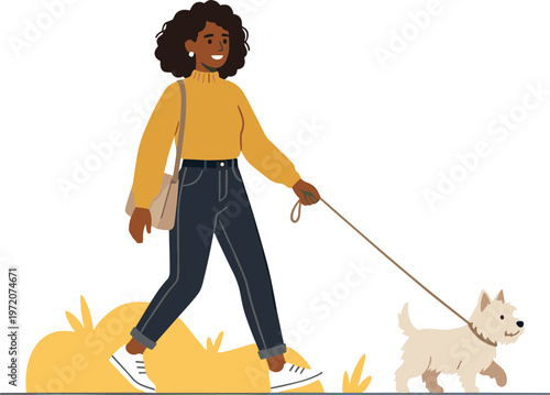 A woman walks her dog on a leash in a park