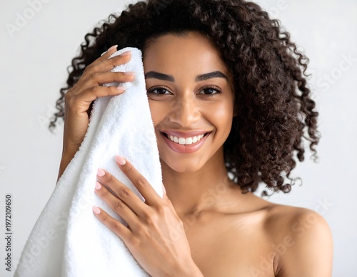 Smiling woman with towel after skincare routine, fresh clean skin and natural beauty