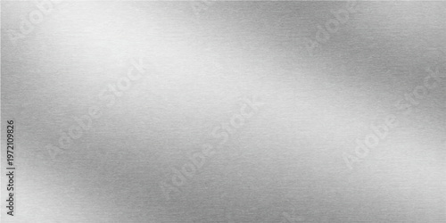 A shiny brushed metal texture features a light silver stainless steel plate surface with a metallic gray pattern backdrop for a sleek industrial material design