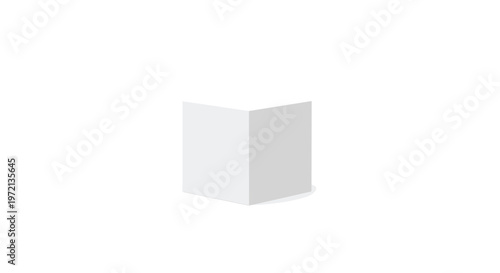 A pristine white three dimensional geometric cube stands perfectly centered on a clean white floor within a bright and completely empty studio space.