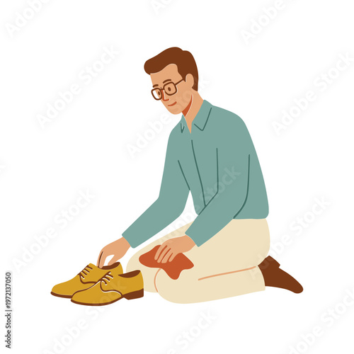 Man kneeling down to polish his brown shoes carefully indoors