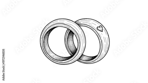 Pair of intricately engraved wedding rings linked together with a heart, representing eternal love and marriage.