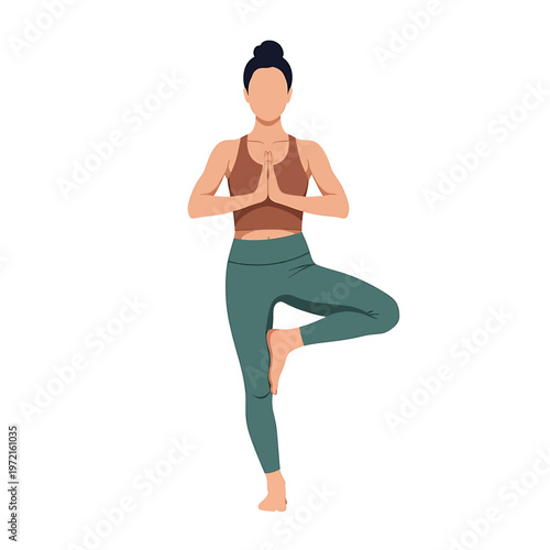 Woman in yoga tree pose standing 2.