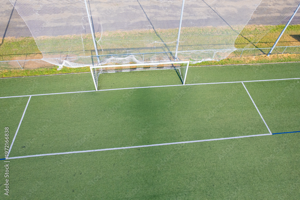 Fototapeta premium Empty football pitch with white goal post The Concept of Athletic Infrastructure