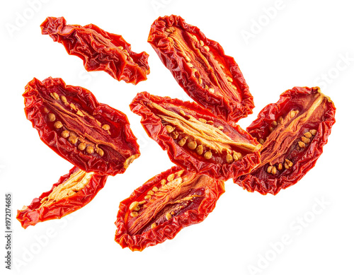 Falling sun-dried tomatoes isolated on white background, flying red dried tomato halves cutout for mediterranean food and cooking compositing
