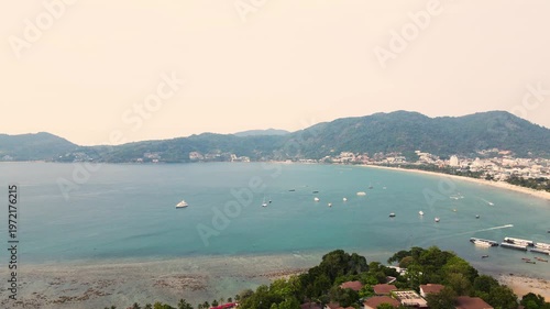 Aerial view beautiful Patong Beach in Phuket Thailand, Landscape of patong city phuket in sunny summer day time, Beautiful tropical sea,High angle view Sea beach Sunset in the evening