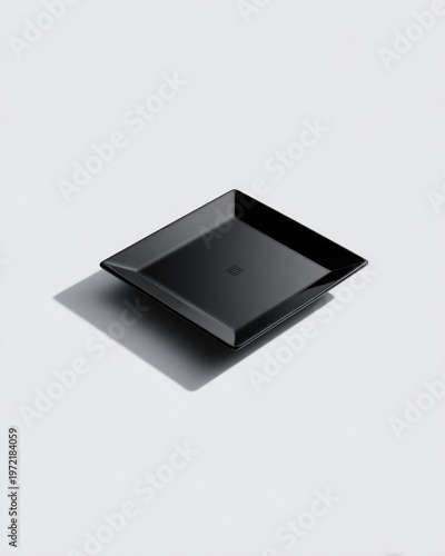 Elegant black carbon fiber plate display studio setting product photography minimalist view