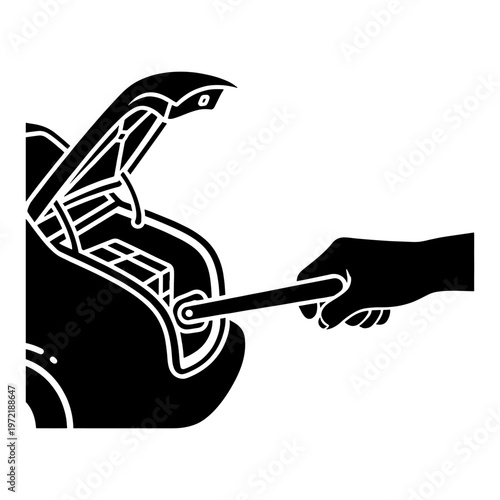 A hand using a lug wrench to remove a tire from a car stark silhouette