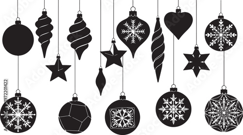 Black and white Christmas ornaments hanging on strings isolated on white