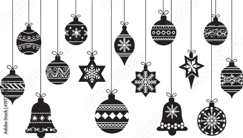 Black and white Christmas ornaments hanging from strings on white background