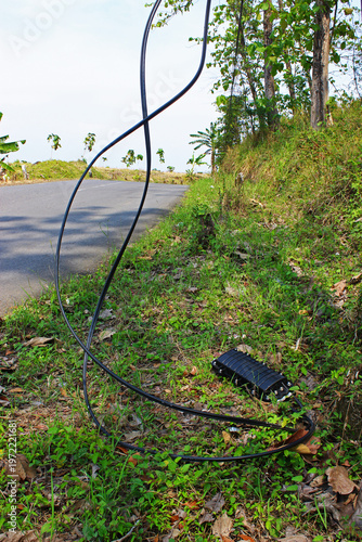 View of cables hanging on the side of the road.