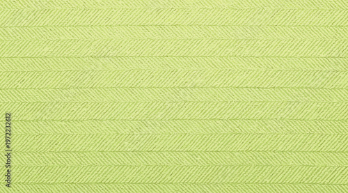 Bright lime green herringbone fabric texture background
