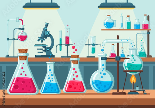 実験室の作業台にさまざまな色の液体が入ったフラスコとビーカーが並んでいる様子。
