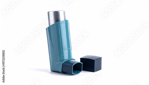 Turquoise asthma inhaler with dark blue cap beside it on a white background