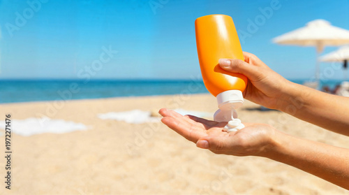 Person pouring sunscreen into palm at the beach on sunny day  