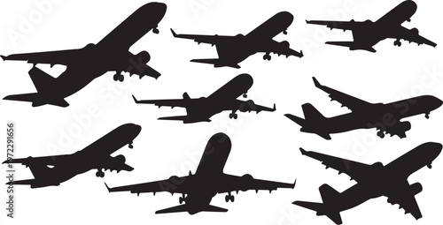 Silhouettes of airplanes flying in different directions and formations together