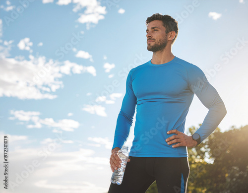 Man in blue shirt exercising outdoors.