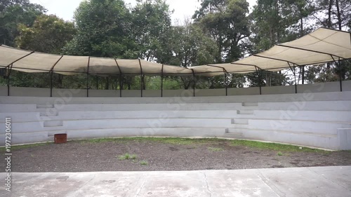 Wallpaper Mural Open-air amphitheater with tiered seating and canopy in a green environment. Torontodigital.ca