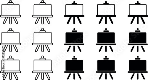 Collection of white and black presentation boards on easels for business meetings and conferences