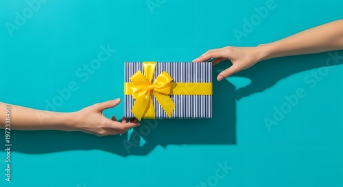 Gift giving two hands exchanging a beautifully wrapped present