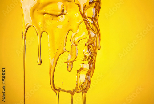 The visual image is an abstract face formed from golden honey, cascading over a bright yellow background. Illustration of health and cosmetology