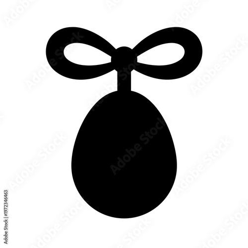 Minimalist Easter egg silhouette with ribbon bow, black festive egg icon vector, simple holiday decoration element for spring greeting cards