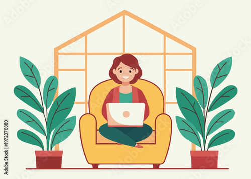 A woman with auburn hair sits cross-legged in a yellow armchair using a laptop computer in a room with two potted plants and a large window.