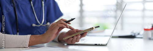 Adult healthcare professional hands using smartphone medical data management digital technology communication work desk office environment patient records research