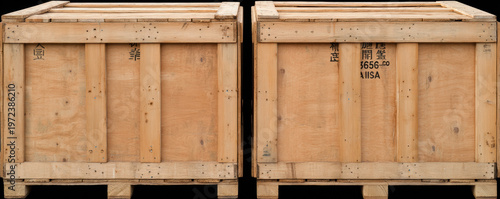 Two large wooden shipping crates placed side by side, constructed with vertical slats and marked with black stenciled text and symbols.