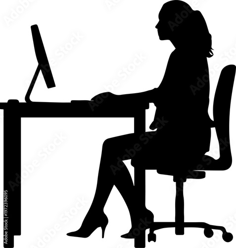 Silhouette of a Professional Woman Sitting at a Desk Working on a Computer in an Office Setting