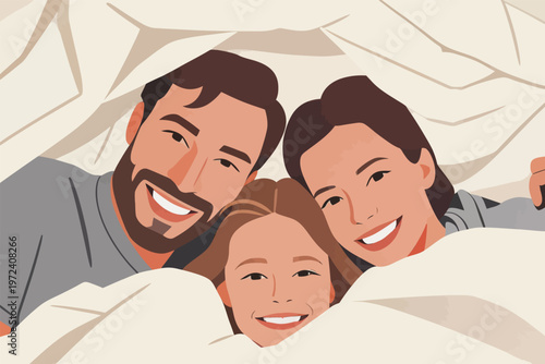 Family enjoys playful moment under blanket in cozy indoor setting during morning time at home