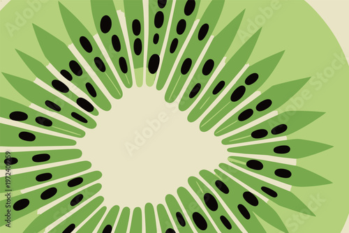 Close view of a sliced kiwi showing its seeds and green flesh with a light background