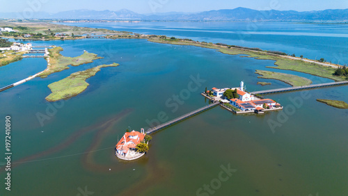 Aerial view of the Monastery of Agios Nikolaos on Vistonida Lake with wooden bridges, Xanthi, Greece.