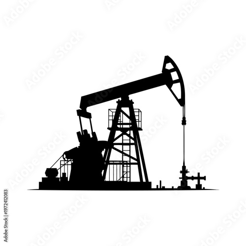 Oil pump jack standing silent on open flat plain