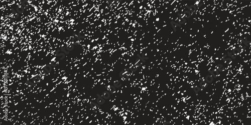 An elegant black and white vector background featuring high quality distressed noise texture with artistic white grain and stipple effects for premium vintage or urban industrial designs.
