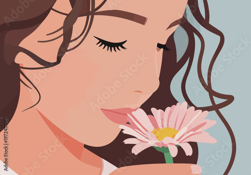Woman smelling a flower in a simple setting with soft colors during daytime
