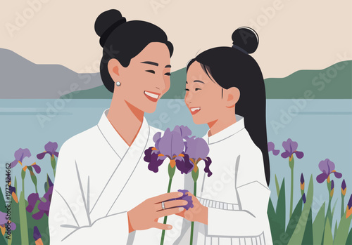 Mother and daughter enjoy time together while holding purple flowers by the water during a sunny day in a garden setting