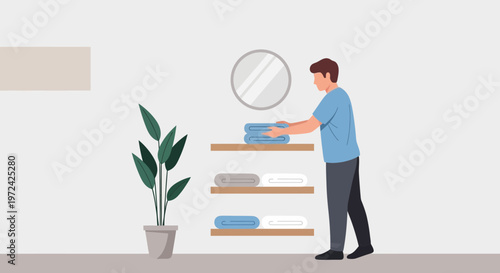 Man folding laundry and putting towels on shelves in a modern bathroom