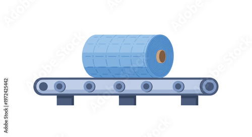 A large and heavy roll of quilted blue textile material moves along a sturdy grey industrial conveyor belt within a modern manufacturing facility setting.