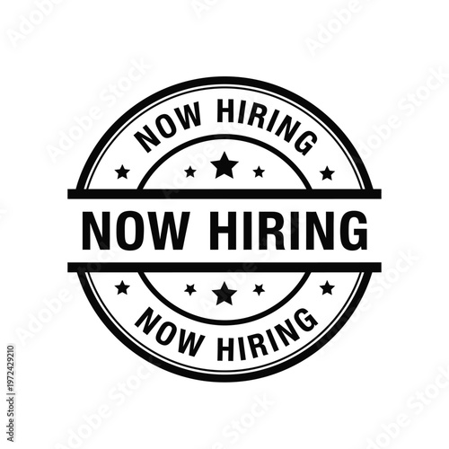 A circular black and white sign displays the text now hiring repeated three times with surrounding stars high quality