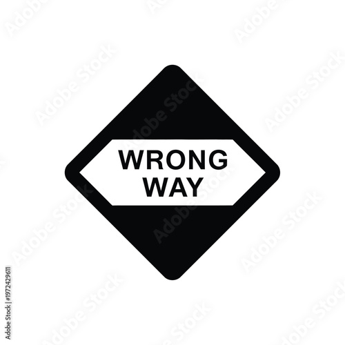 A black diamond shaped sign displays the words wrong way in all capital letters alerting drivers to a dangerous