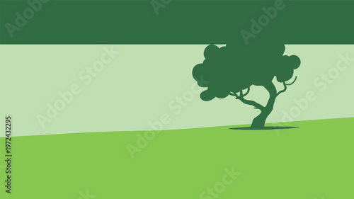 Tree stands alone in green field under a clear sky during midday with bright sunlight shining down