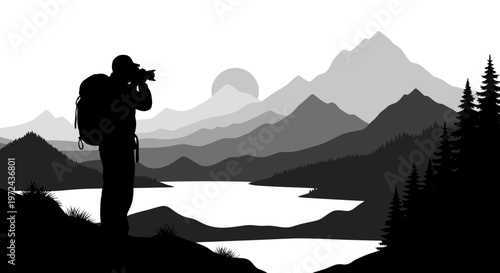 Silhouette of photographer with backpack capturing mountain landscape at sunset