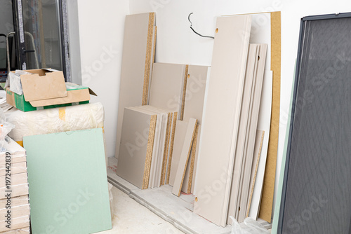 Wooden doors and mirrors in package and other home renovation materials