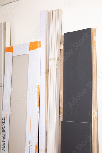 Wooden doors and mirrors in package for home renovation 